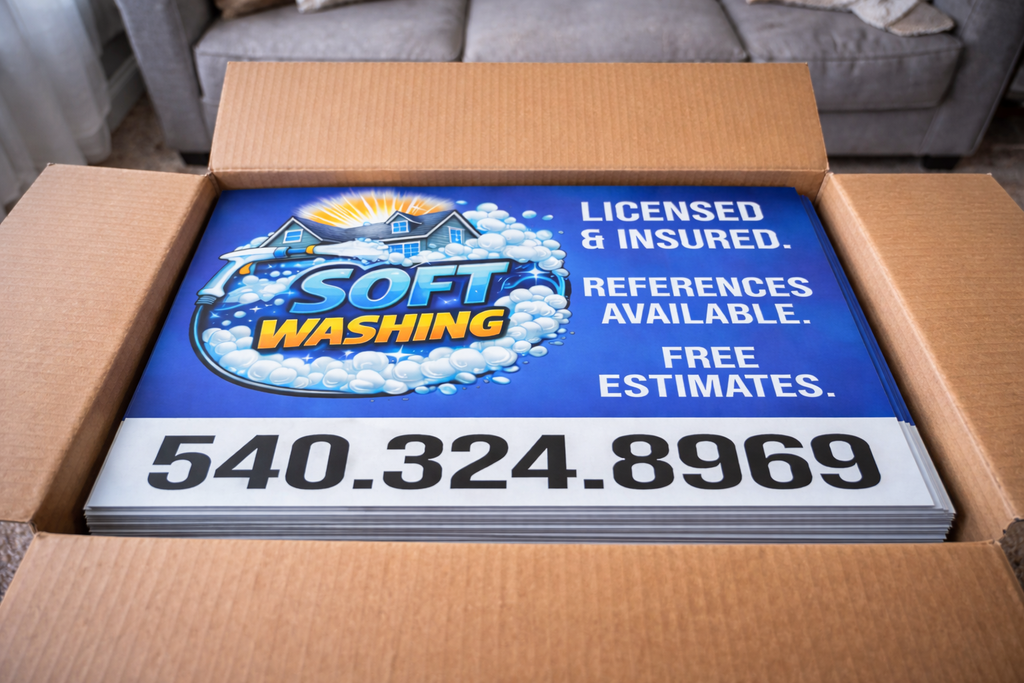 Sign for soft washing services in a cardboard box, with a couch in the background.